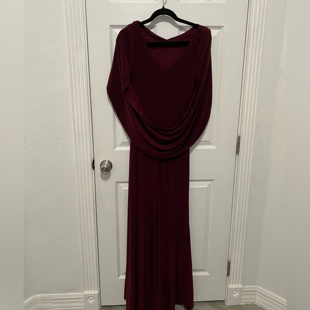 Wine Cape Long Sleeve Trumpet Gown
Betsy & Adam - Picture 6 of 7